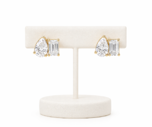 Aretes dormilonas “Tú y Yo” corte pera y baguette en oro 14K con zirconias brillantes